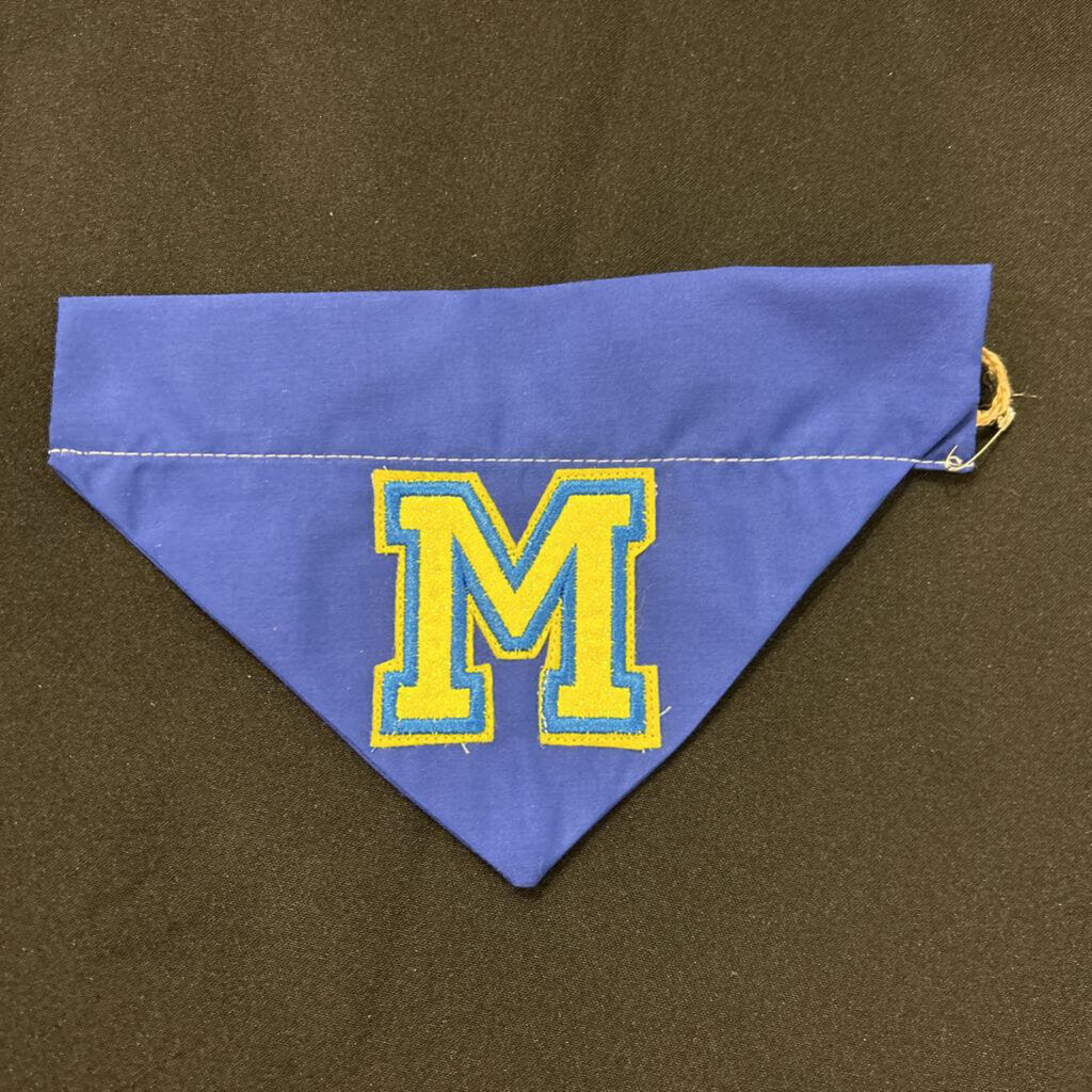 blue embroidered M in yellow dog bandana