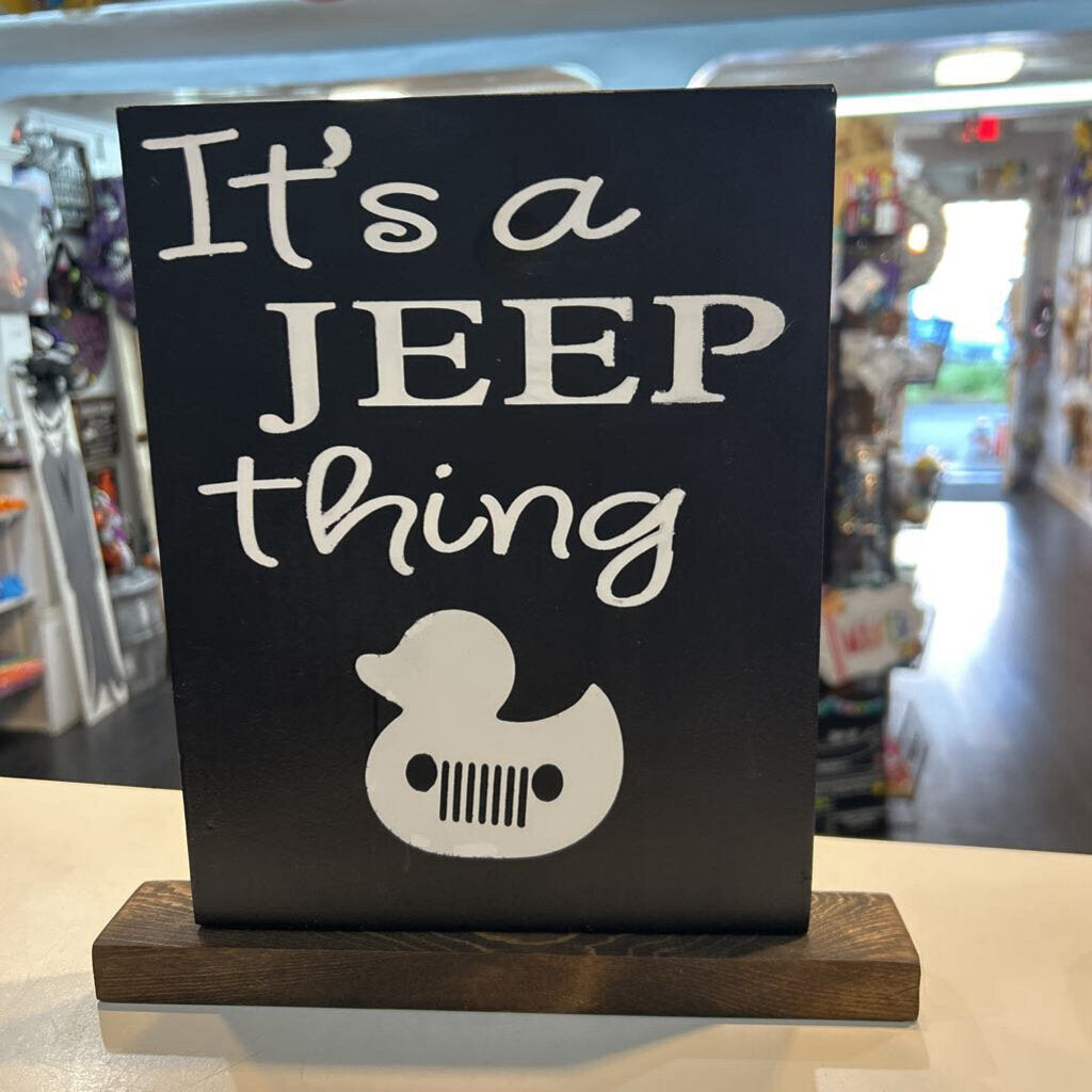 It's a Jeep Thing black with white Jeep