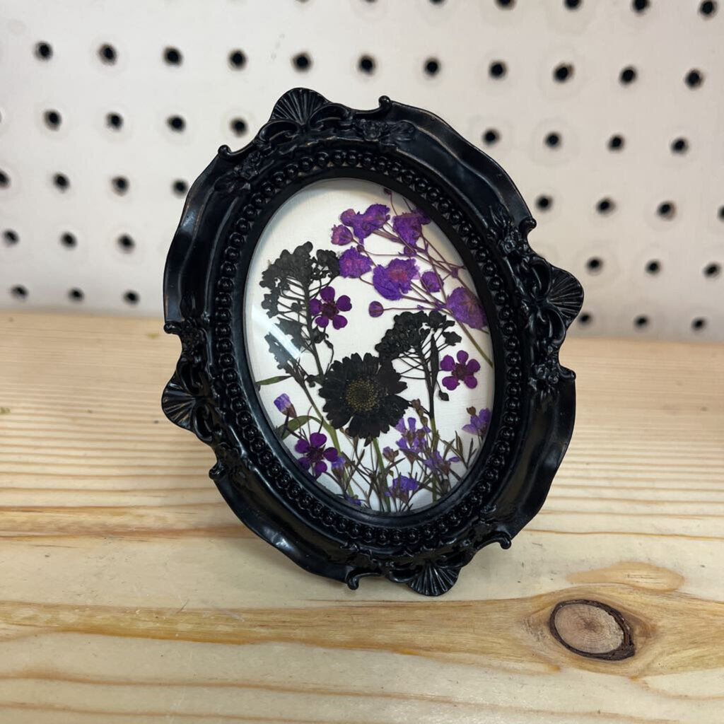Black oval frame w/black & purple flowers, 2x3