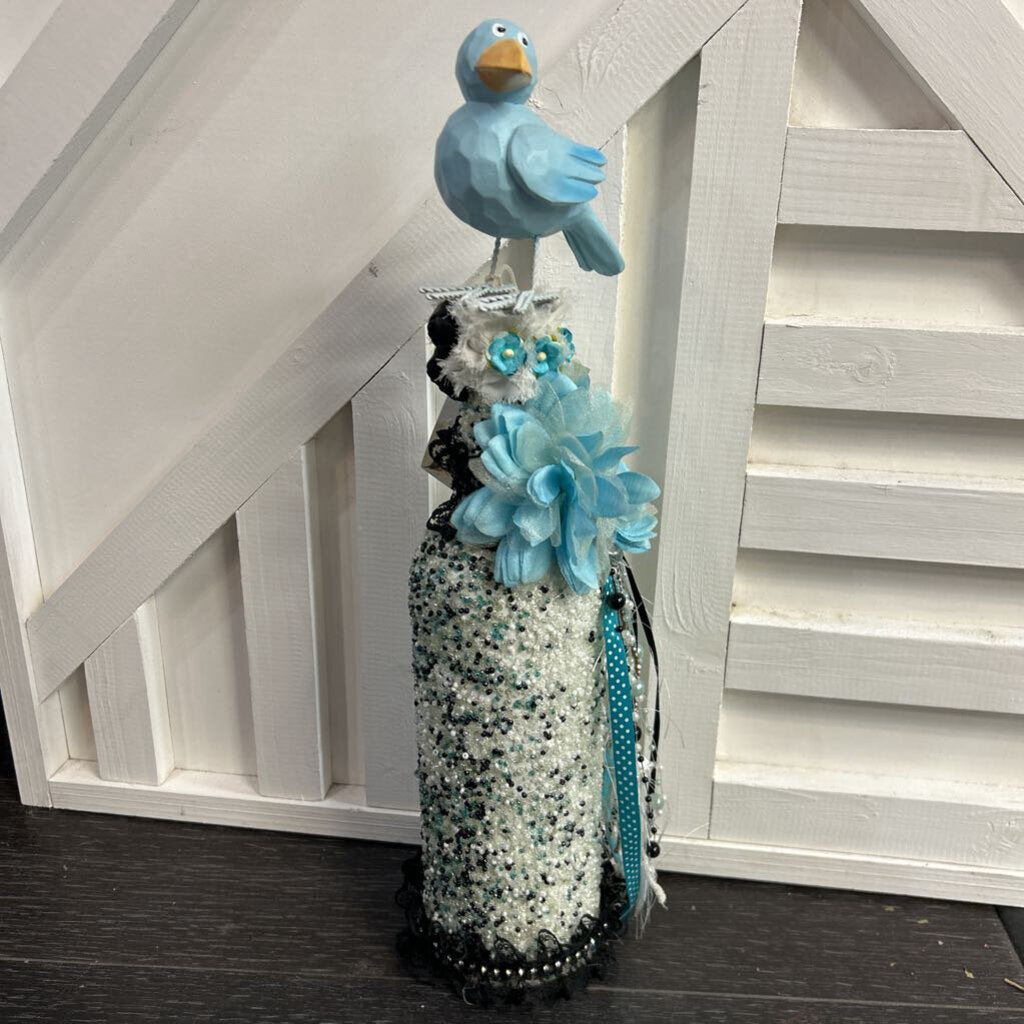 Decorative blue beaded bottle with blue bird