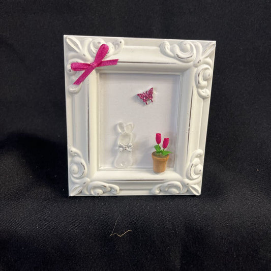 White Frame; Bunny sitting next to flowerpot, pink bow
